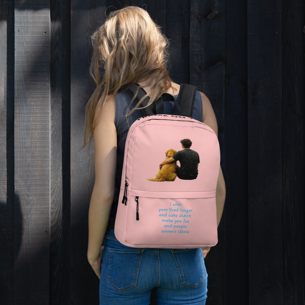 Pink everyday backpack worn on back; teddy bear graphic with blue text on front