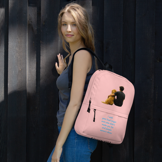 Pink backpack with front zipper, teddy charm on side pocket, worn by model