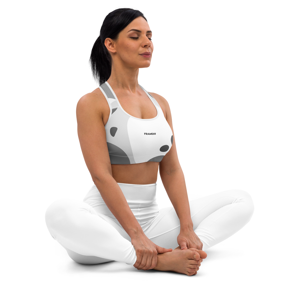 Padded graphic sports bra with white base and gray abstract print, racerback back
