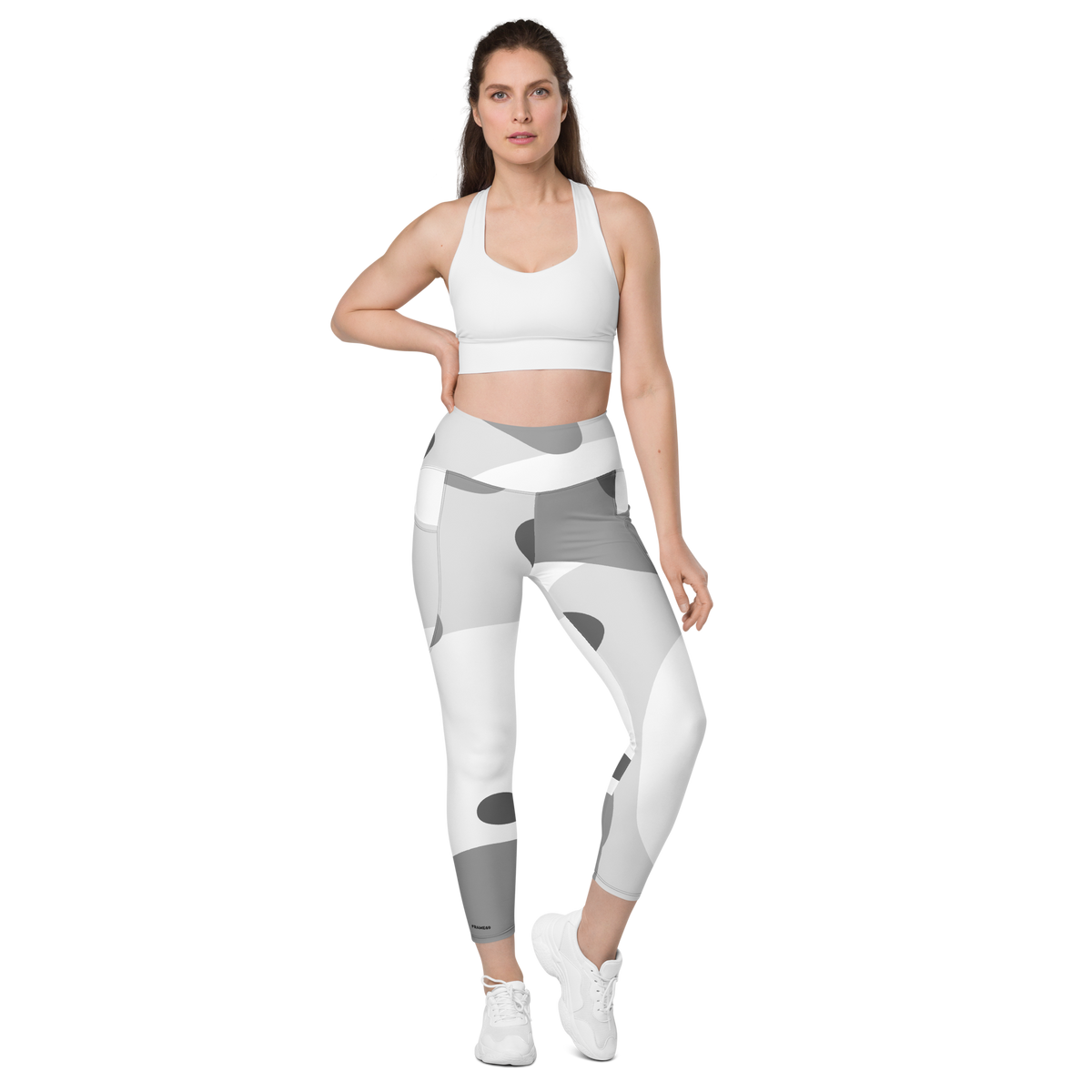 High-waisted leggings with gray-and-white camo print, form-fitting full length