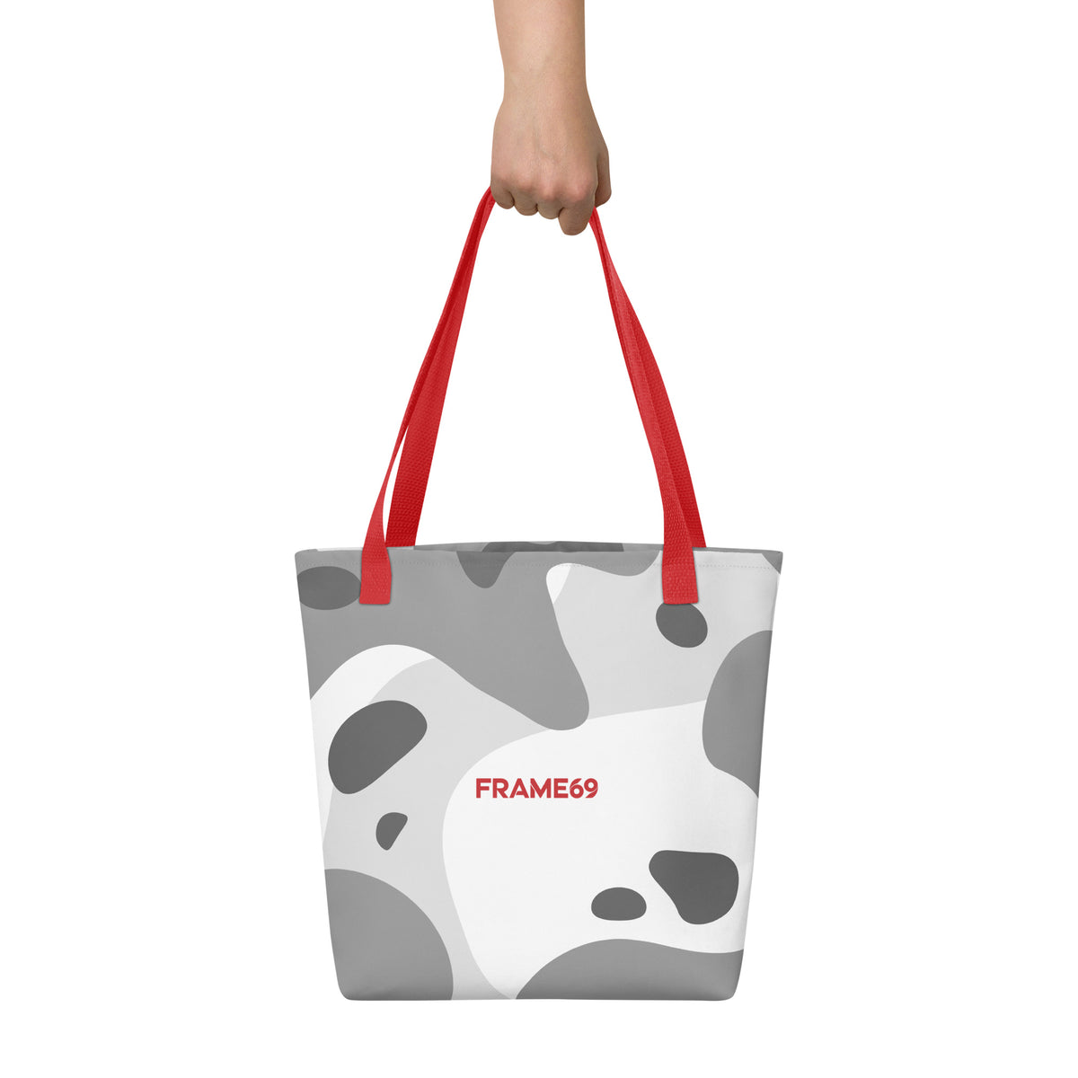 White graphic tote bag with red handles and abstract cow print, FRAME69.