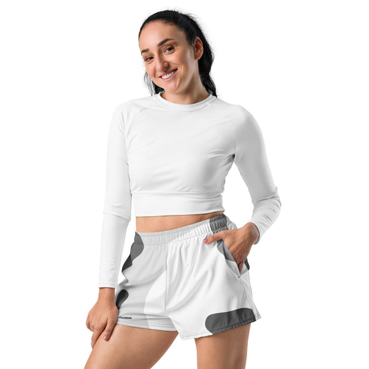 White performance shorts with gray abstract panels and elastic waistband