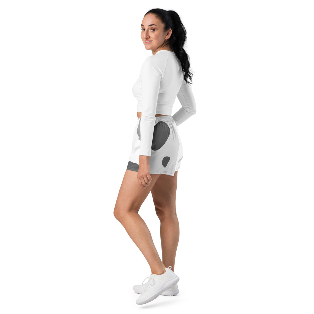 White performance shorts with gray abstract patchwork print, elastic waistband