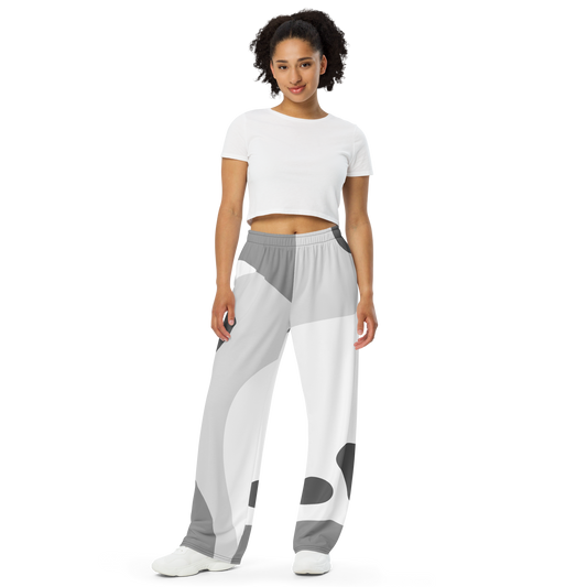 White wide-leg lounge pants with abstract gray and dark shapes, elastic waistband.