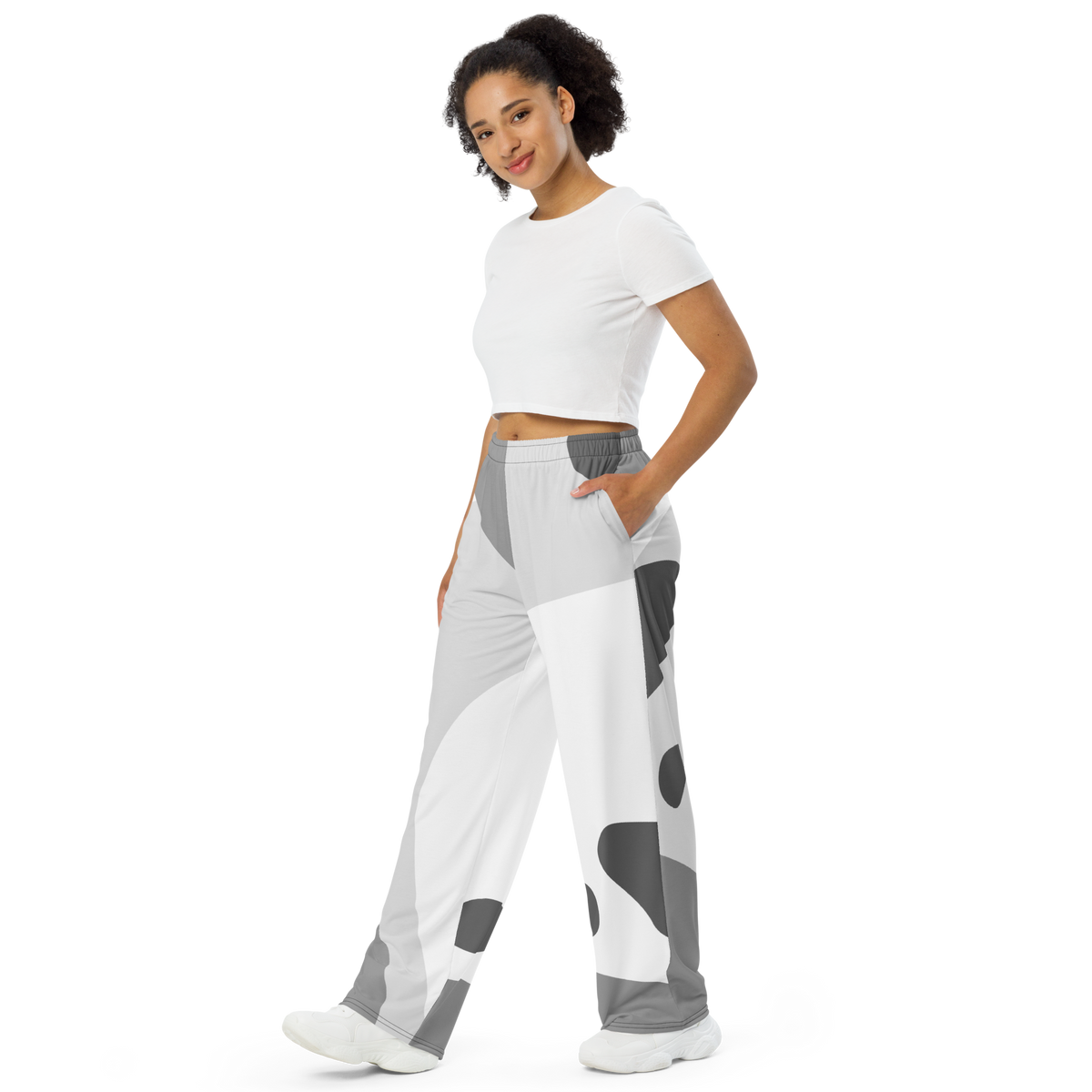 White wide-leg lounge pants with bold abstract gray blocks and elastic waist.