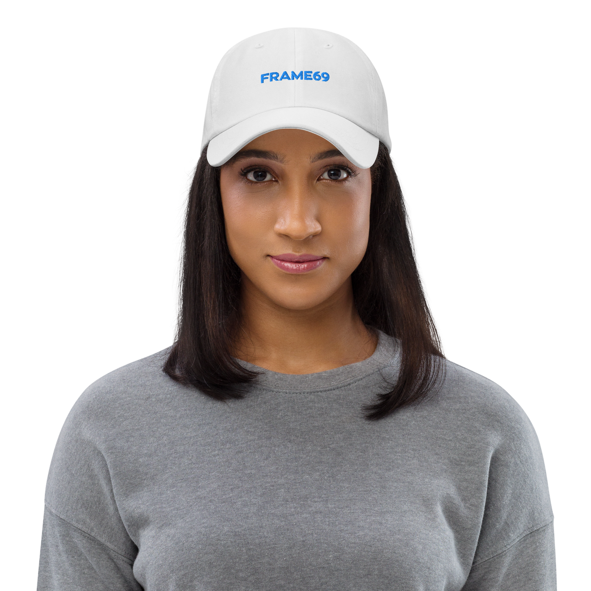 White chino dad hat worn by model, FRAME69 logo on front