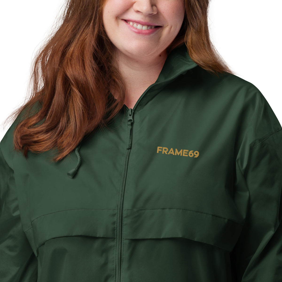 Forest green windbreaker jacket with FRAME69 logo on chest, zip front