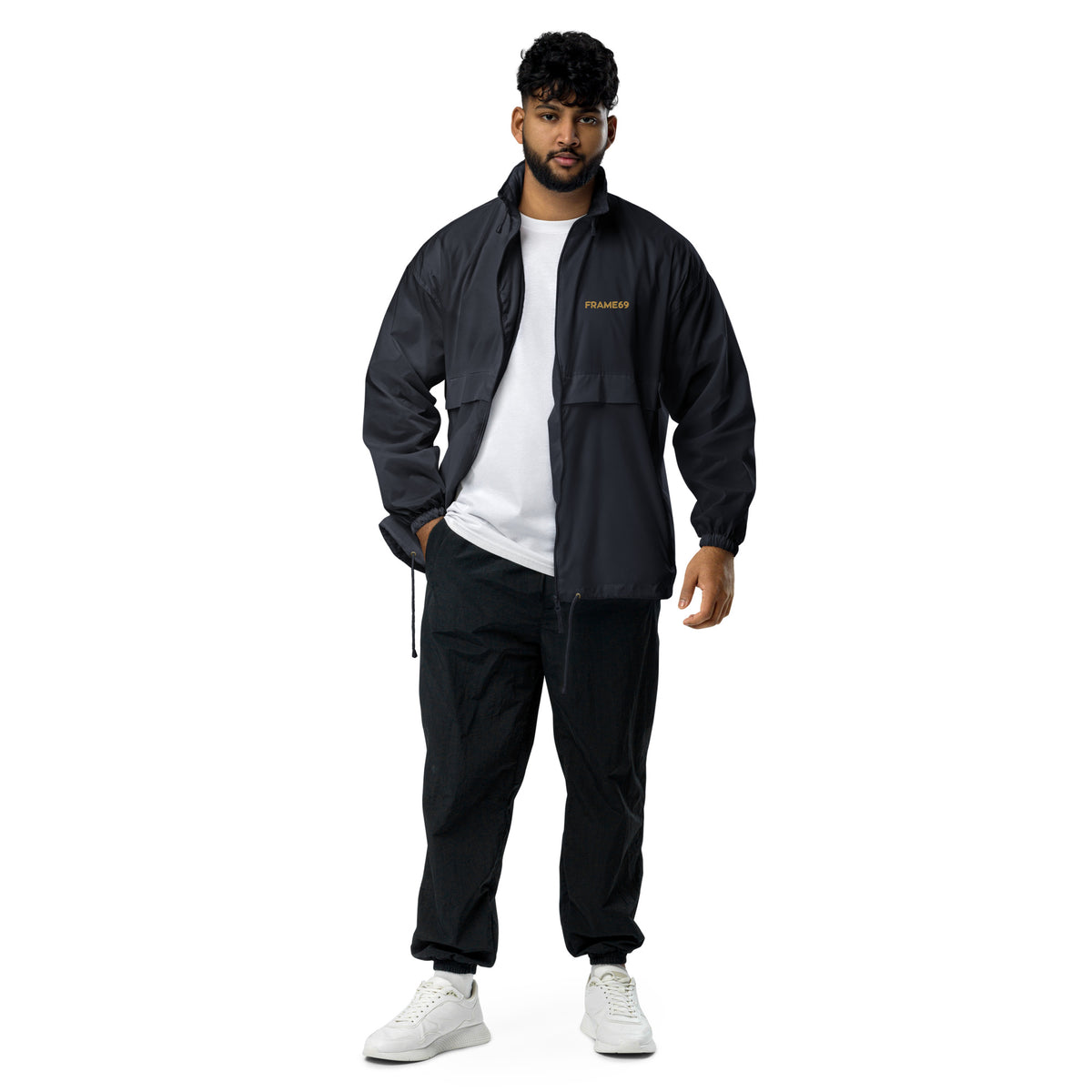 Black windbreaker jacket with hood and center zipper worn open; FRAME69 logo visible