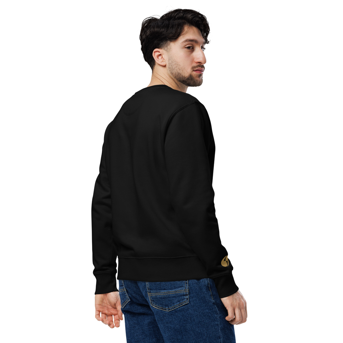 Black crewneck sweatshirt, side view with gold emblem near sleeve cuff