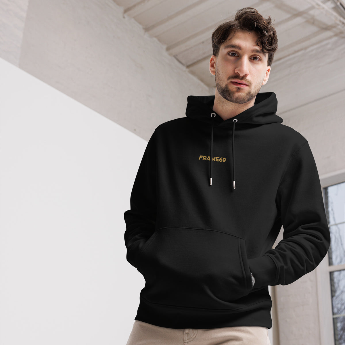 Black hoodie close-up with hood and FRA ME69 chest text