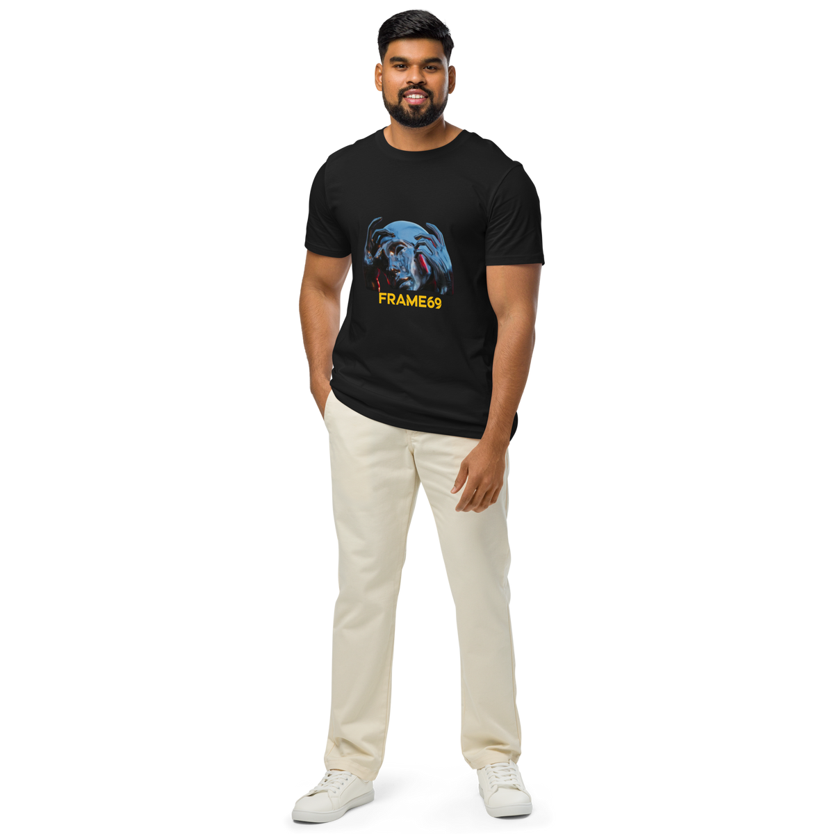 Black graphic crew-neck T-shirt with colorful face print and “FRAME69” text, worn