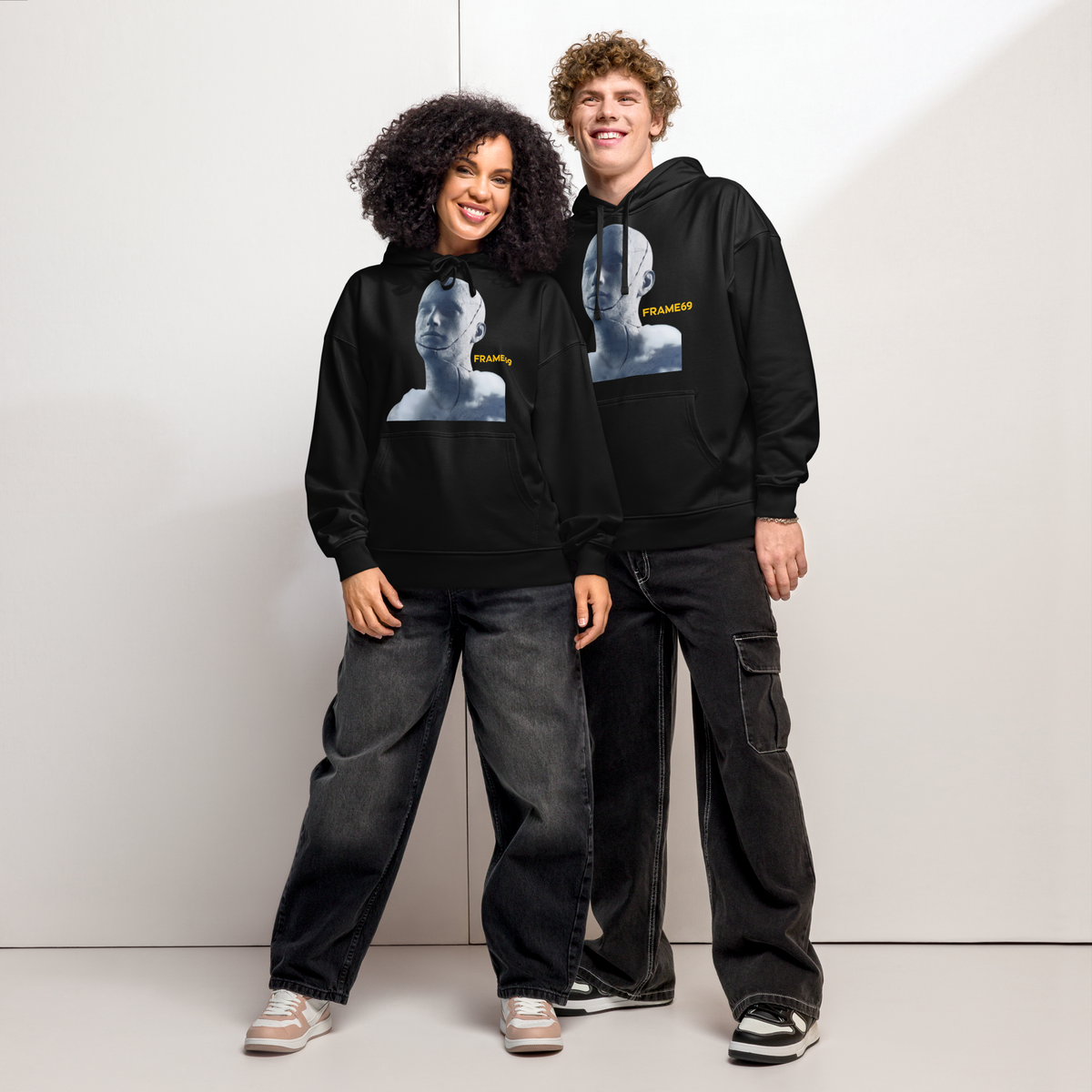 Black pullover hoodie with hood and front portrait graphic, front view on model