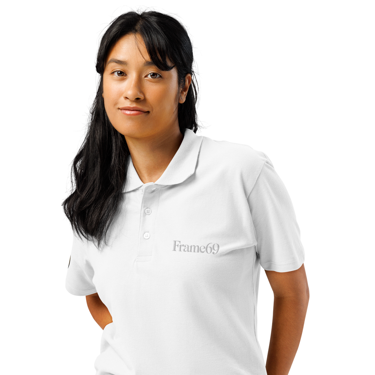 White pique polo shirt with button placket, short sleeves, and chest logo