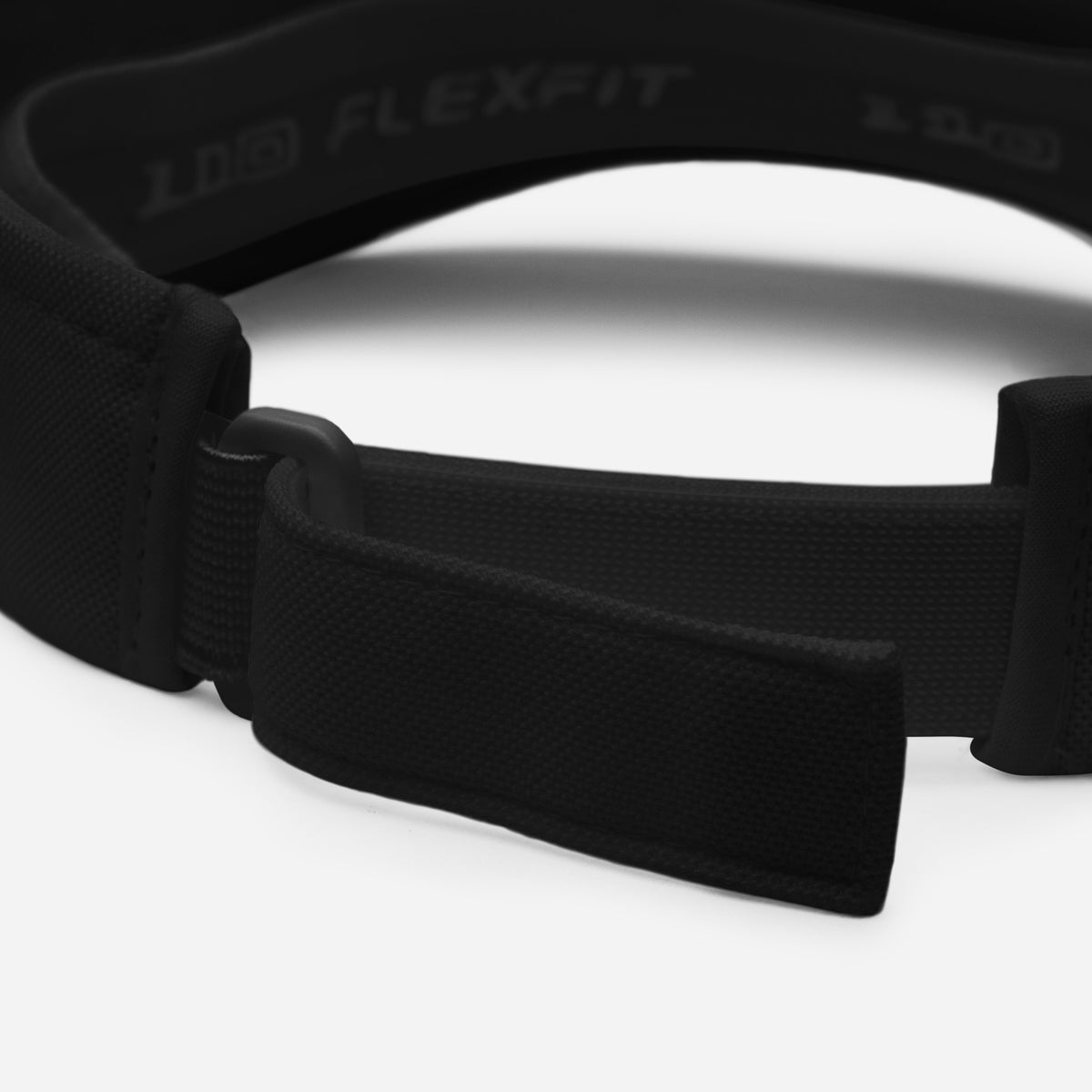 Black classic visor close-up of textured adjustable strap with FLEXFIT embossing