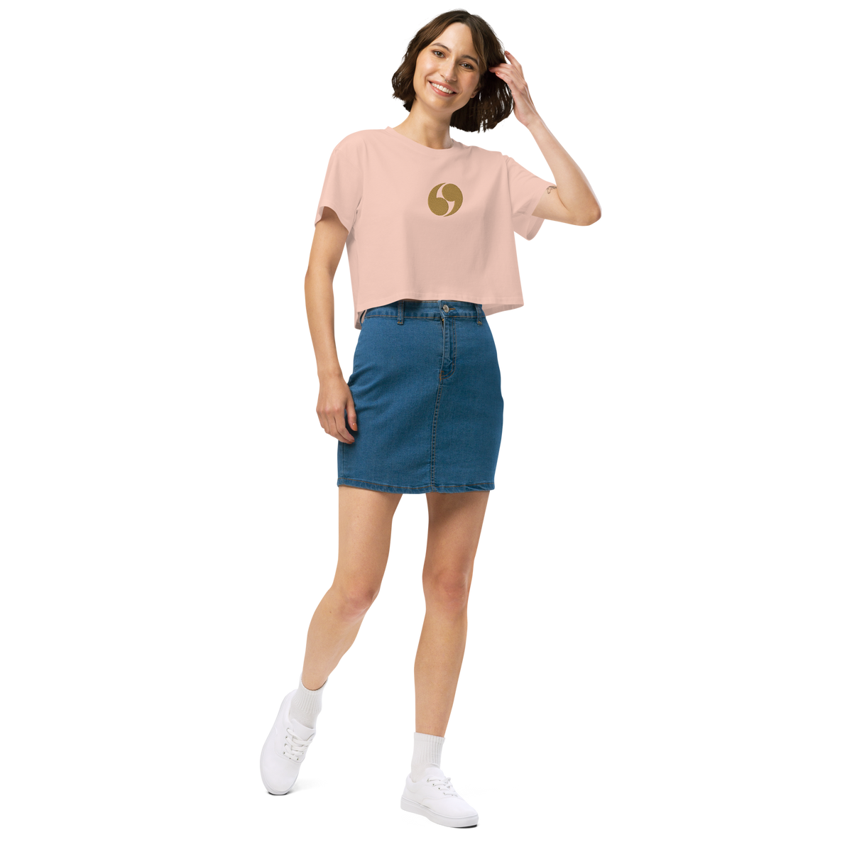 Light pink cropped tee with short sleeves and small gold logo